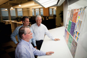 Photo of Gary Brown, Ken Hatterick and Dennis Smith of Beck Atlanta study color targets